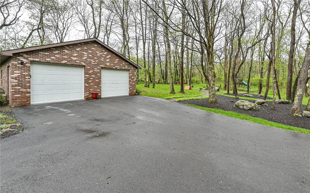 230 Election House Road Butler, PA 16001 - Photo 4 of 38 a view of a house with a yard and garage