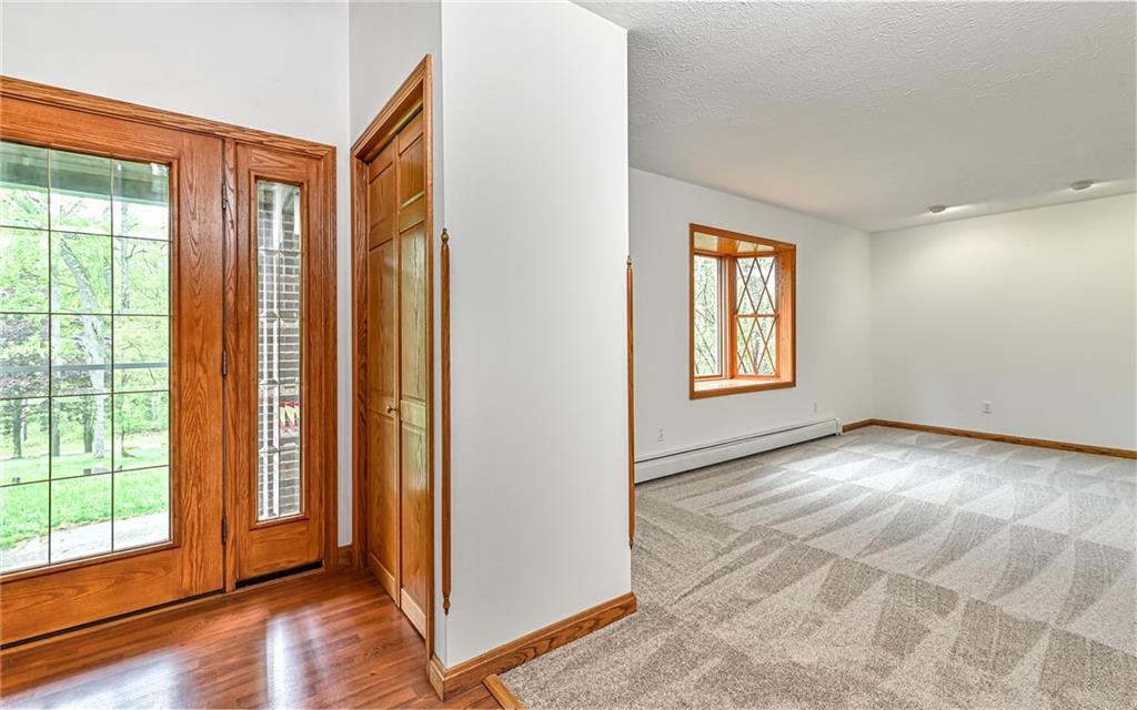 230 Election House Road Butler, PA 16001 - Photo 6 of 38 an empty room with wooden floor and windows