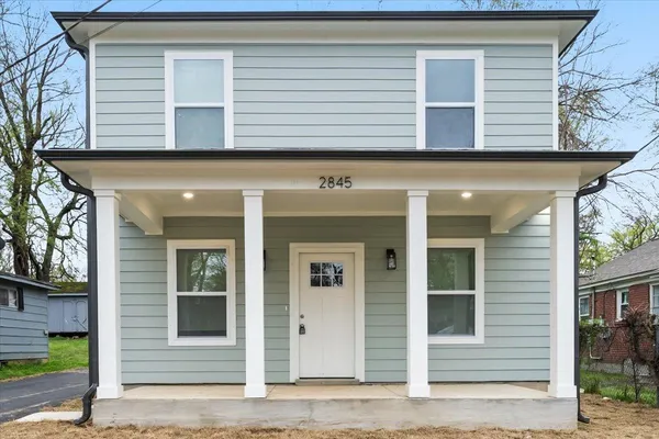 a view of a house with a window and door