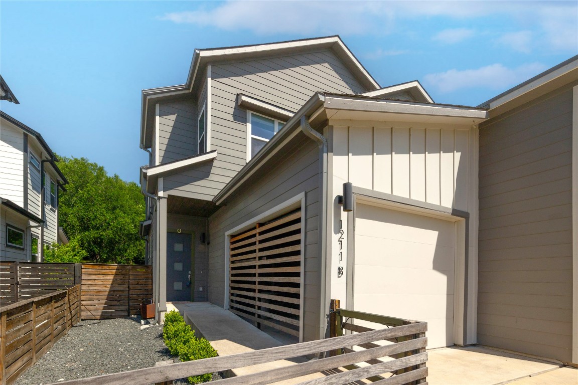 1211 Cometa Street, Unit B Austin, TX 78721 - Photo 1 of 1 a front view of a house with a garden