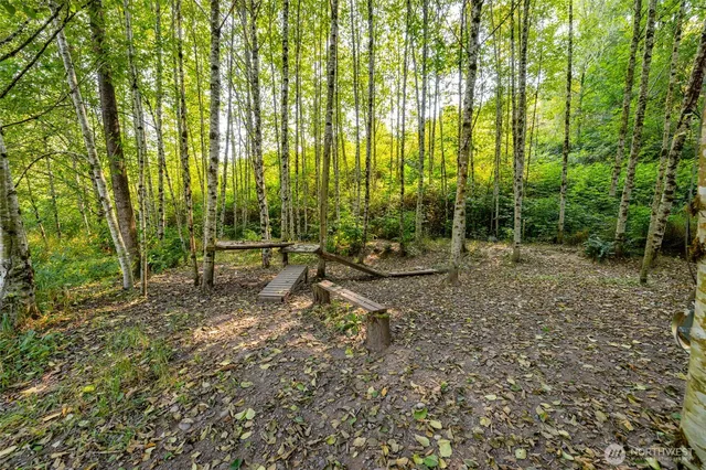 a view of outdoor space with lots of green space and trees