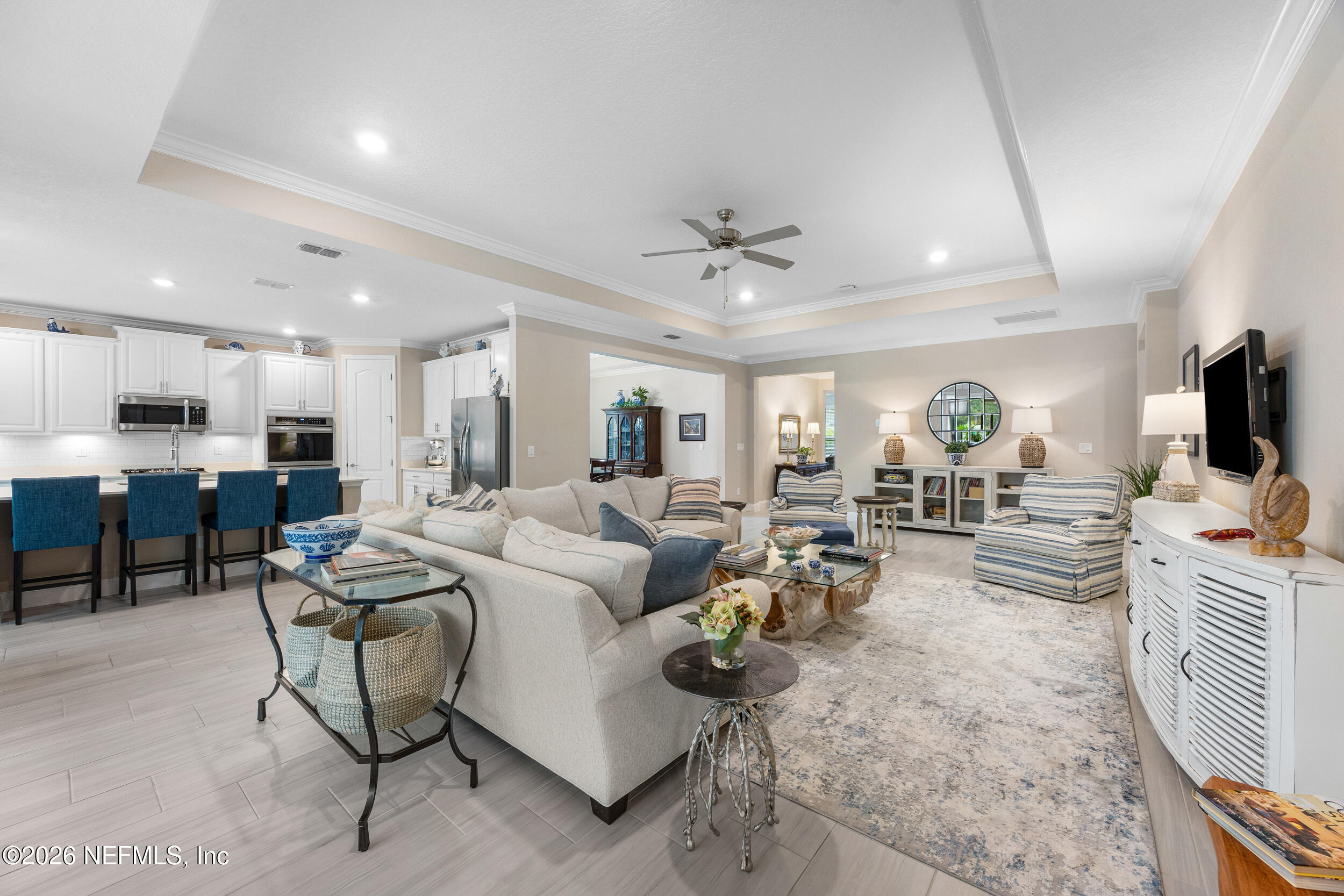 311 Dosel Lane St. Augustine, FL 32095 - Photo 6 of 37 a living room with furniture kitchen view and a large window
