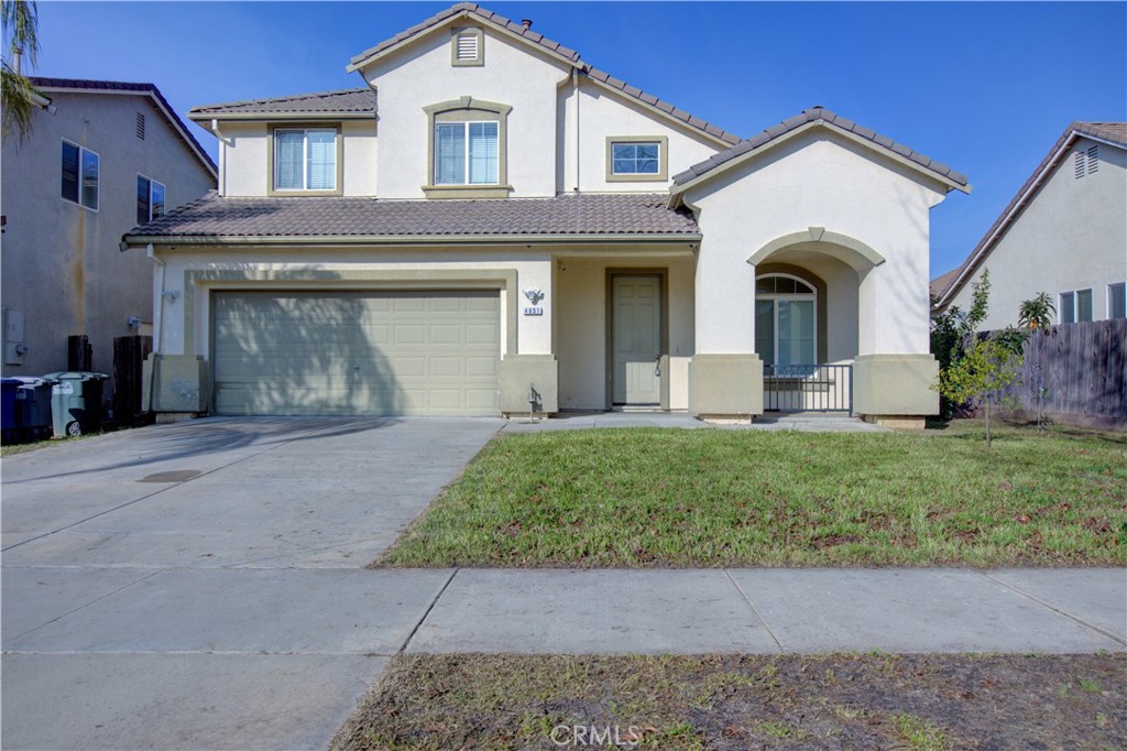 4651 Stern Drive Merced, CA 95348 - Photo 1 of 38 a front view of a house with garden