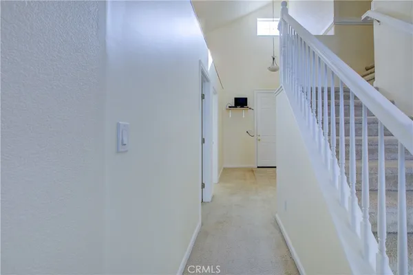a view of a hallway with staircase