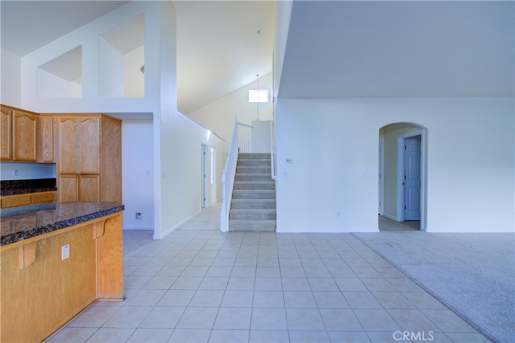 4651 Stern Drive Merced, CA 95348 - Photo 18 of 38 a view of a kitchen with stairs and an empty room