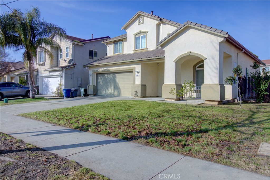 4651 Stern Drive Merced, CA 95348 - Photo 2 of 38 a front view of a house with garden