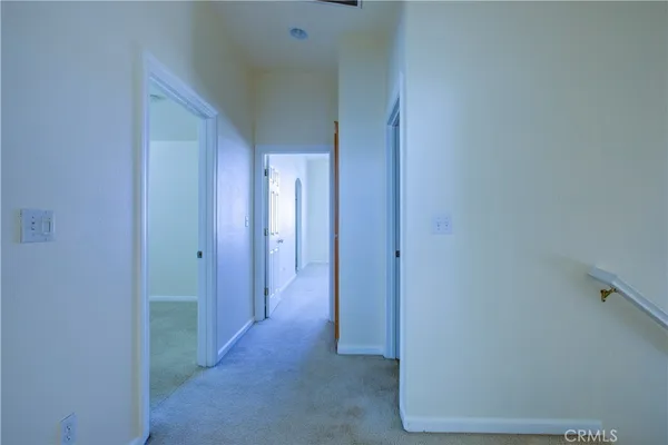 a view of a hallway with closet