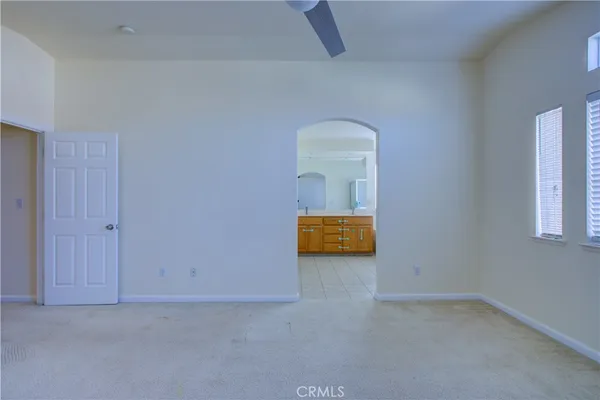 an empty room with a mirror