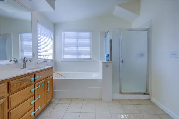 a bathroom with a bathtub and a sink