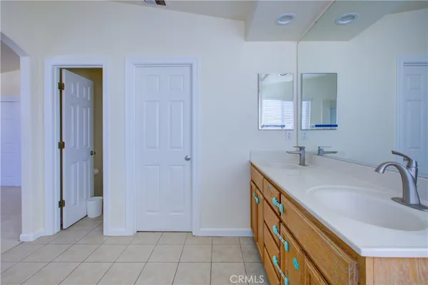 a bathroom with 2 sink and a mirror