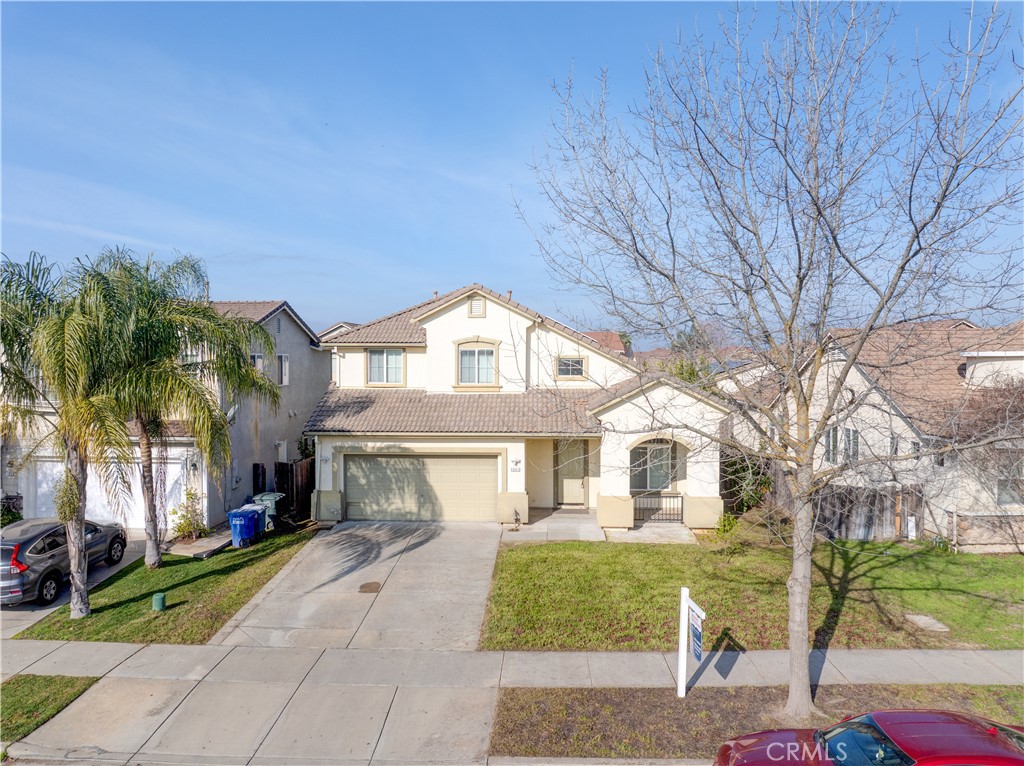 4651 Stern Drive Merced, CA 95348 - Photo 35 of 38 a front view of a house with a garden