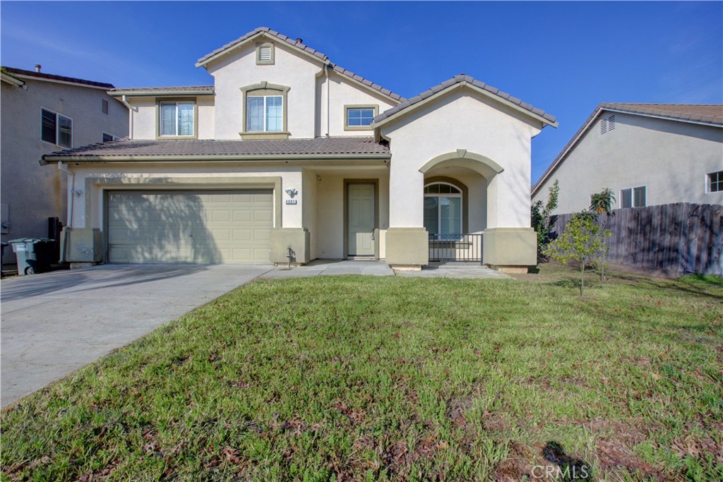 4651 Stern Drive Merced, CA 95348 - Photo 4 of 38 a front view of a house with garden