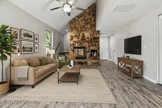 a living room with furniture and a flat screen tv