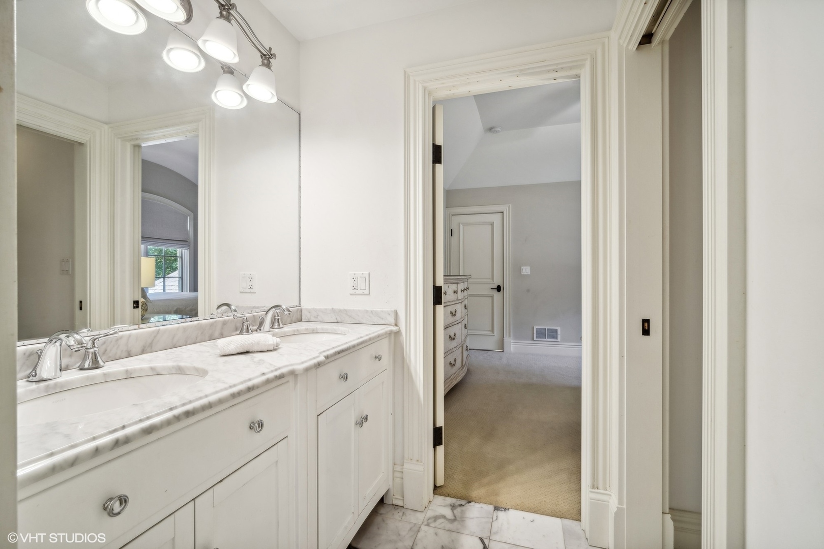 630 Forest Road Glenview, IL 60025 - Photo 19 of 44 a bathroom with a granite countertop sink mirror and a shower