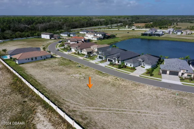 an aerial view of a city with ocean view