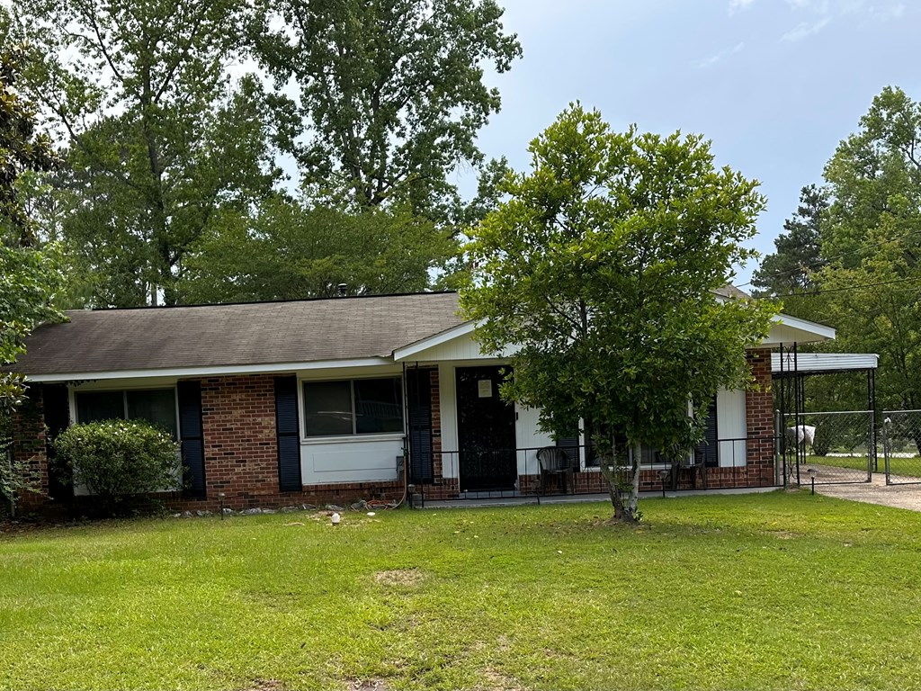 3245 Doyle Avenue Columbus, GA 31907 - Photo 13 of 21 a front view of a house with a garden