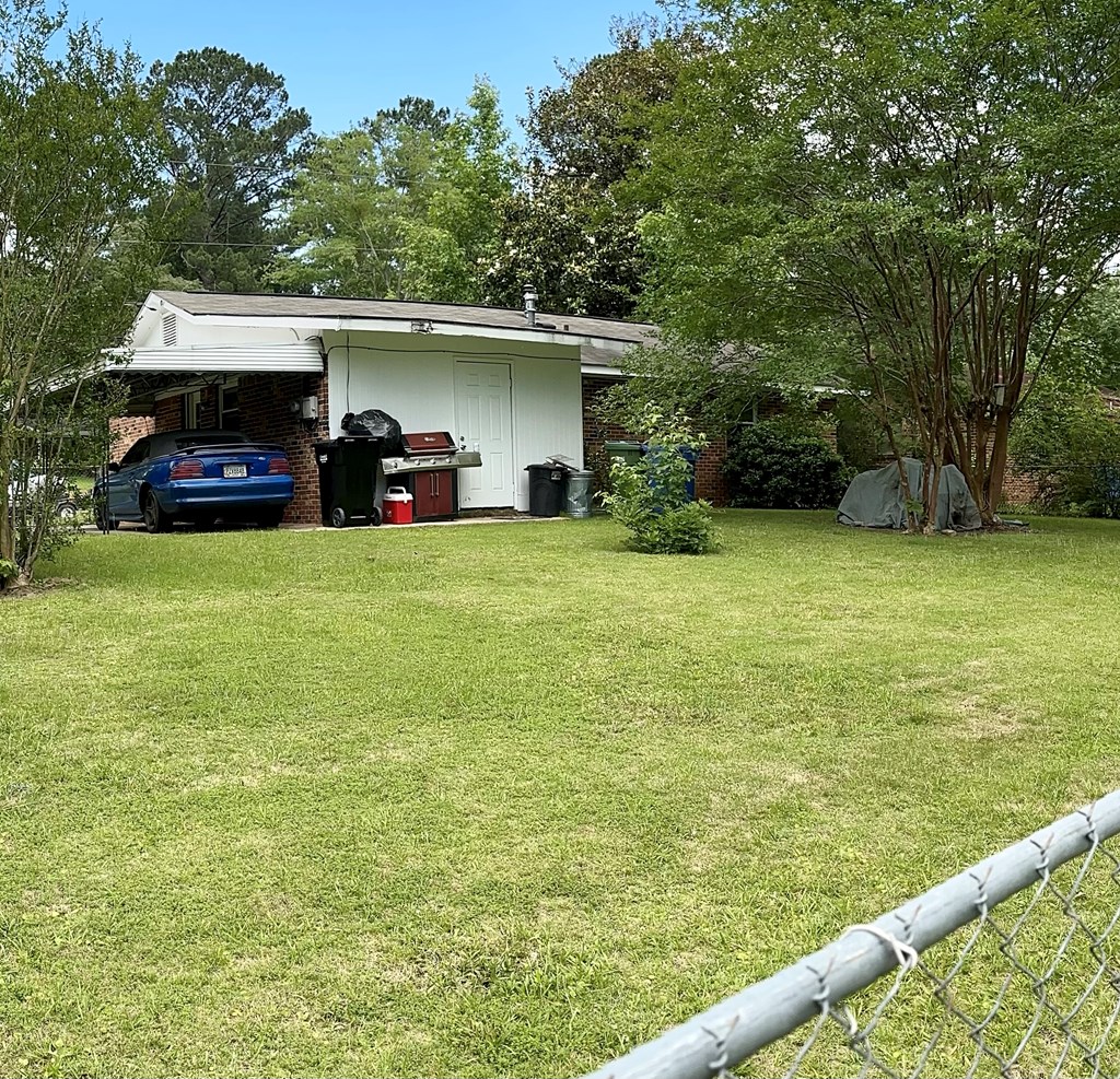 3245 Doyle Avenue Columbus, GA 31907 - Photo 17 of 21 a view of a house with a yard and sitting area