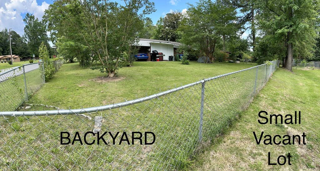 3245 Doyle Avenue Columbus, GA 31907 - Photo 18 of 21 a view of a street sign under a large tree