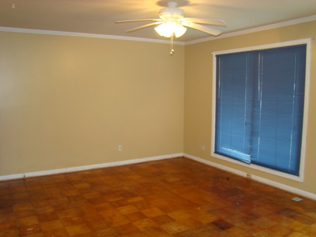3245 Doyle Avenue Columbus, GA 31907 - Photo 7 of 21 an empty room with a windows and chandelier fan