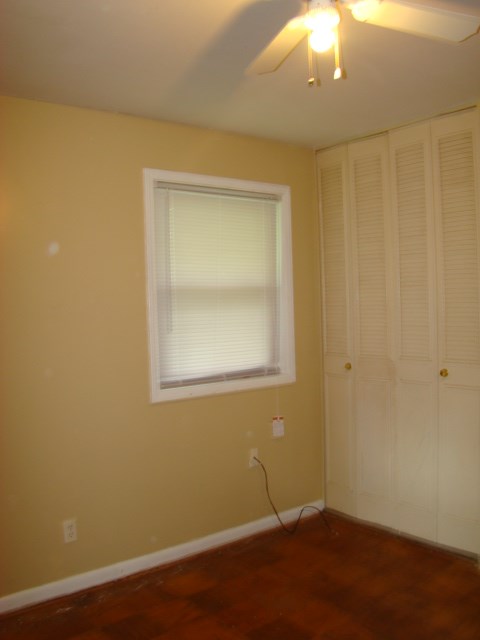 3245 Doyle Avenue Columbus, GA 31907 - Photo 9 of 21 a view of an empty room with wooden floor and a window