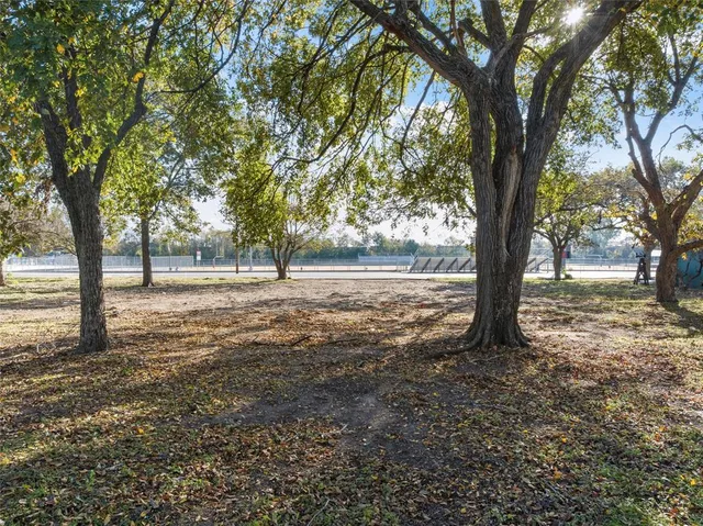 a view of outdoor space with deck and trees