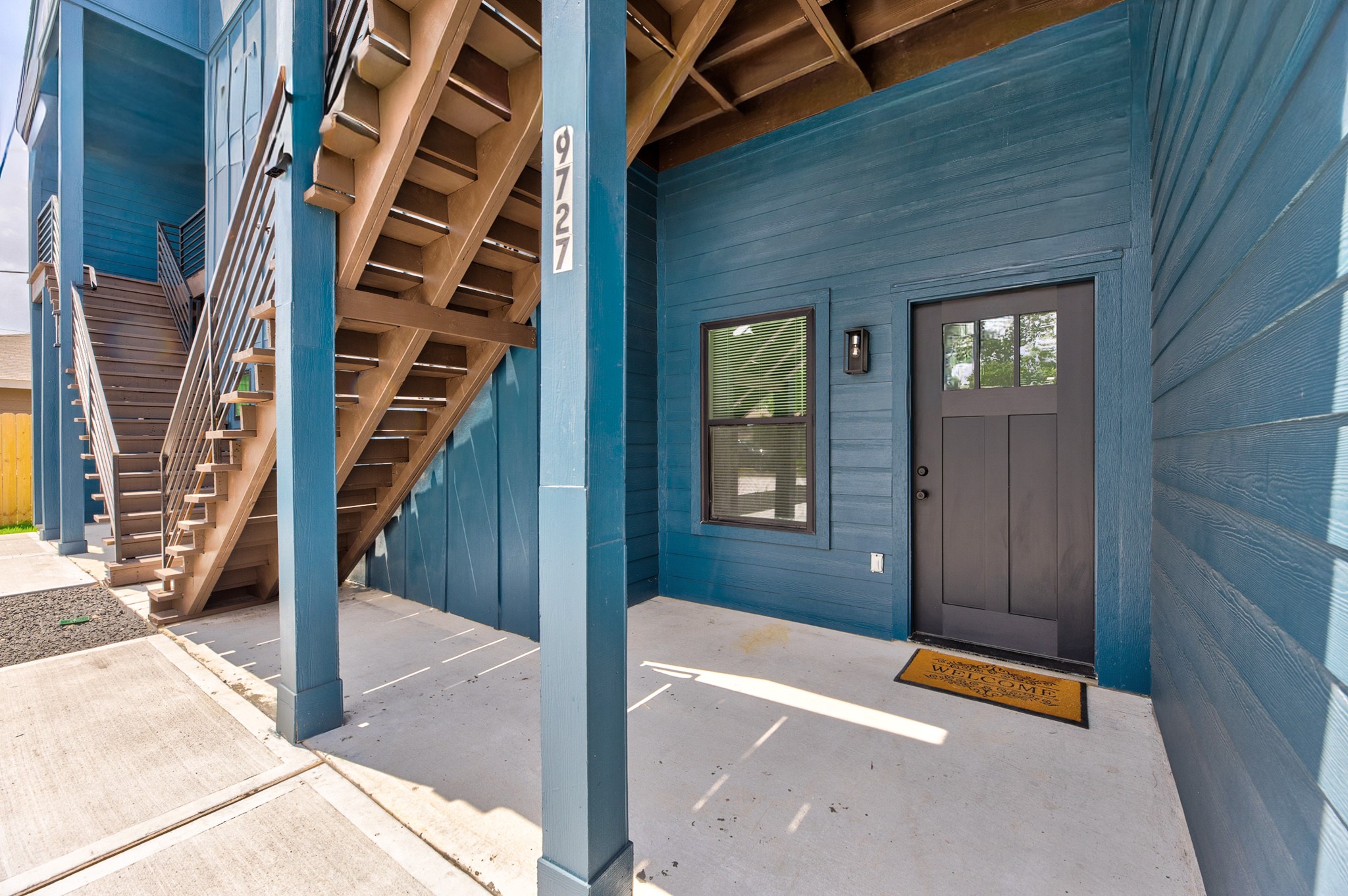 9727 Stedman Street Houston, TX 77029 - Photo 20 of 23 (Unit A) - A welcoming front entry with a private porch space adds charm and functionality, offering a comfortable spot for outdoor seating, morning coffee, or casual relaxation.