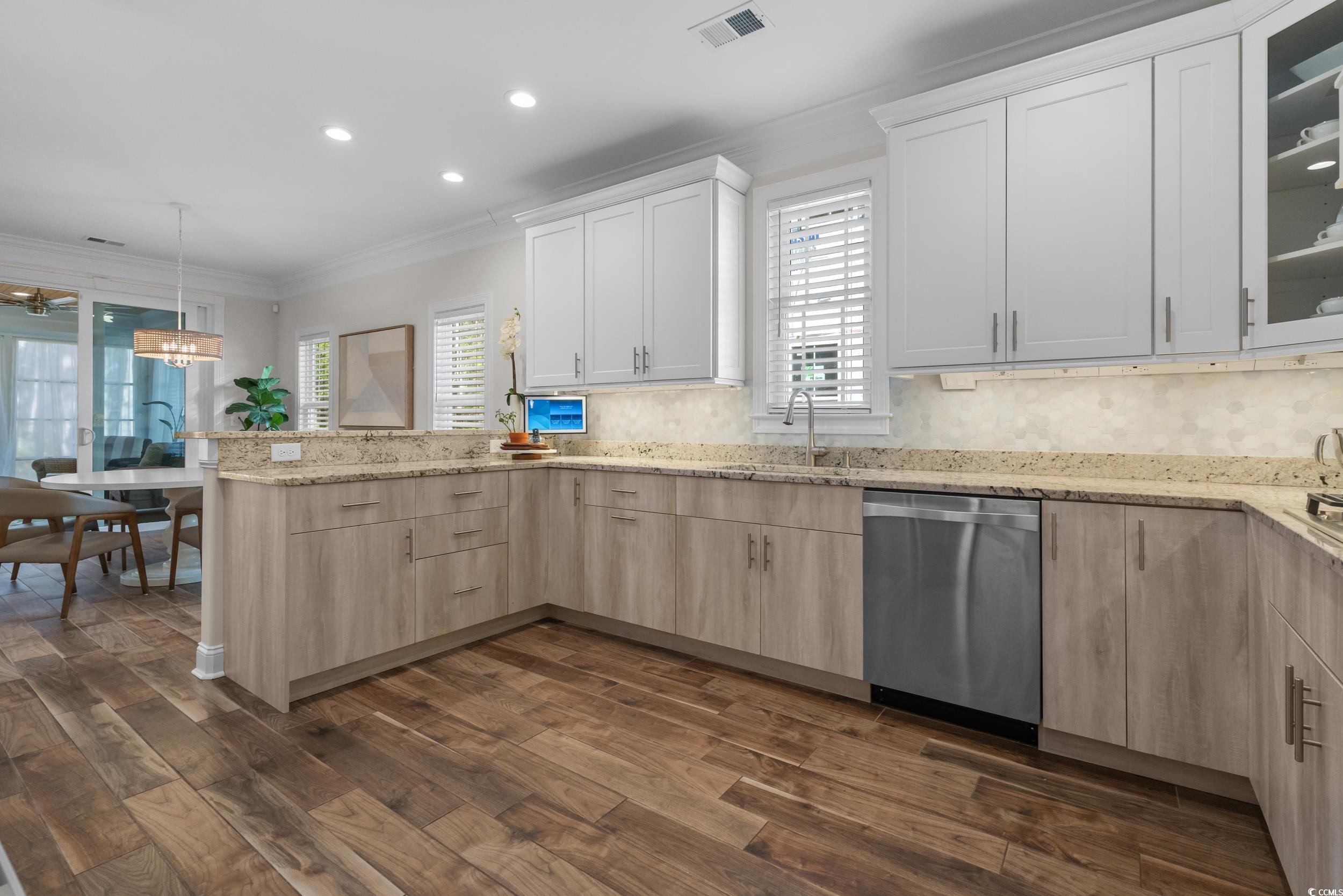 3021 Moss Bridge Lane Myrtle Beach, SC 29579 - Photo 15 of 40 Kitchen featuring a peninsula, stainless steel dishwasher, recessed lighting, light stone countertops, and light brown cabinetry