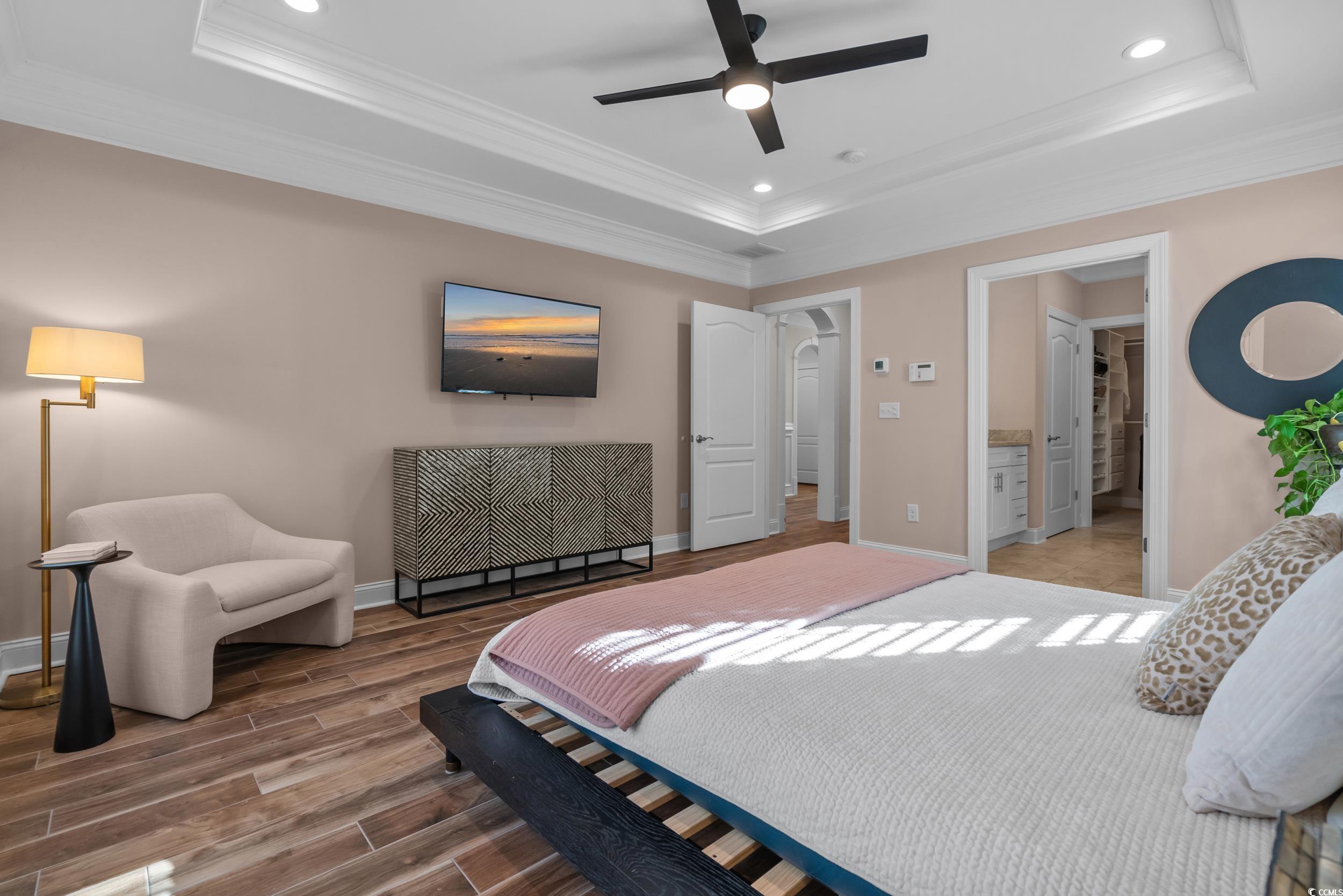 3021 Moss Bridge Lane Myrtle Beach, SC 29579 - Photo 20 of 40 Bedroom featuring recessed lighting, wood finish floors, ornamental molding, ceiling fan, and connected bathroom