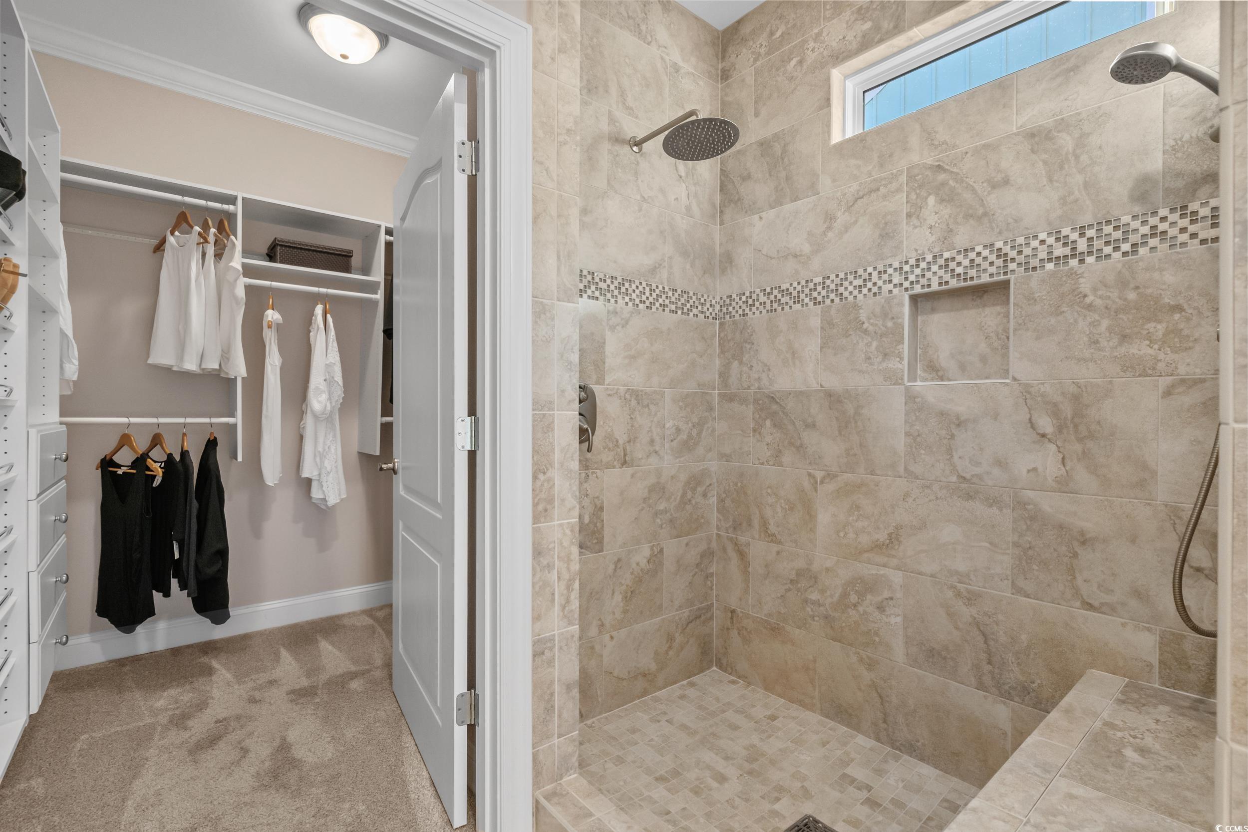 3021 Moss Bridge Lane Myrtle Beach, SC 29579 - Photo 24 of 40 Bathroom featuring tiled shower, carpet flooring, a spacious closet, and crown molding