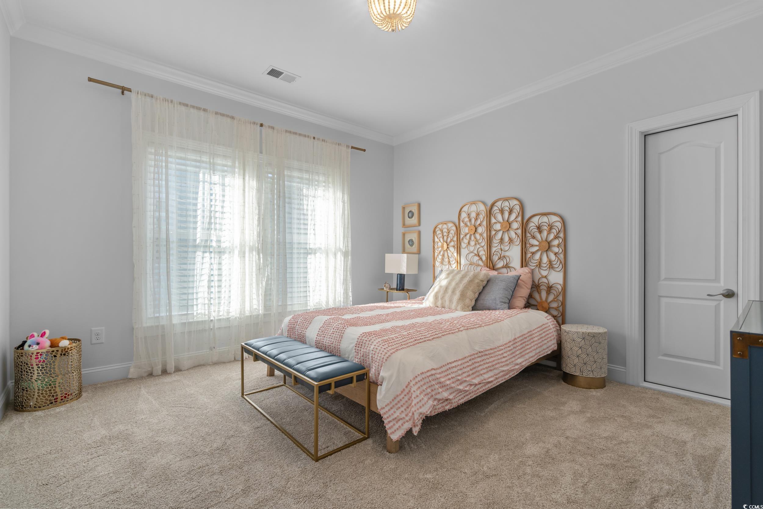 3021 Moss Bridge Lane Myrtle Beach, SC 29579 - Photo 29 of 40 Carpeted bedroom featuring ornamental molding and baseboards