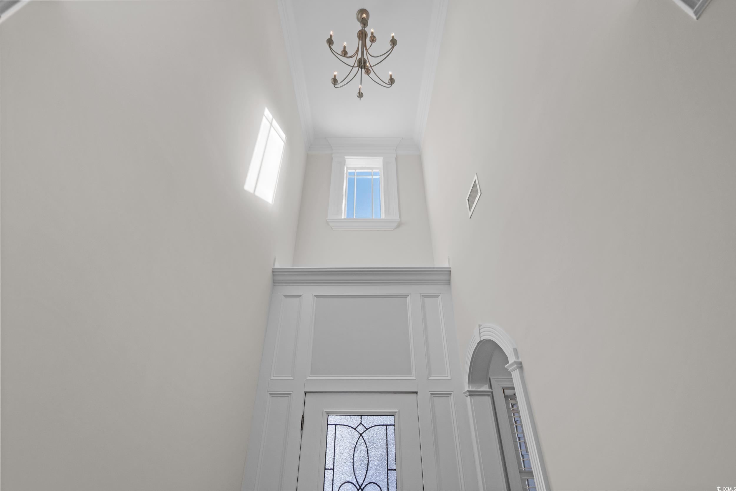 3021 Moss Bridge Lane Myrtle Beach, SC 29579 - Photo 5 of 40 Detailed view of a chandelier and crown molding