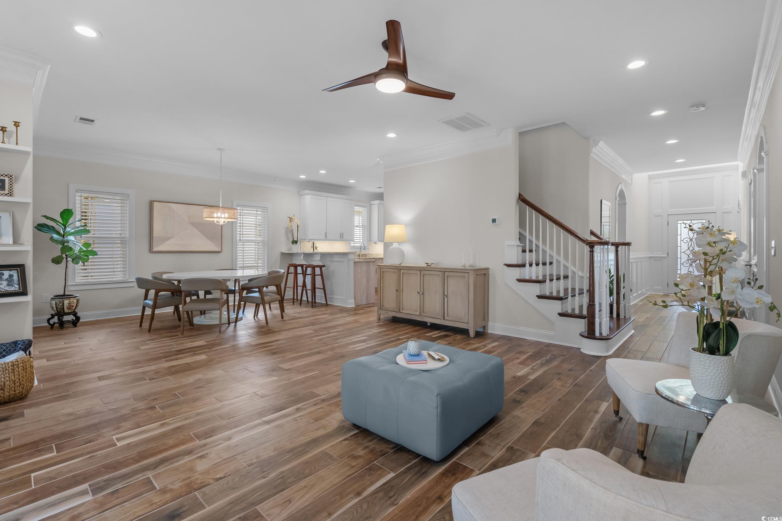 3021 Moss Bridge Lane Myrtle Beach, SC 29579 - Photo 8 of 40 Living room with ornamental molding, a ceiling fan, wood finish floors, recessed lighting, and stairway