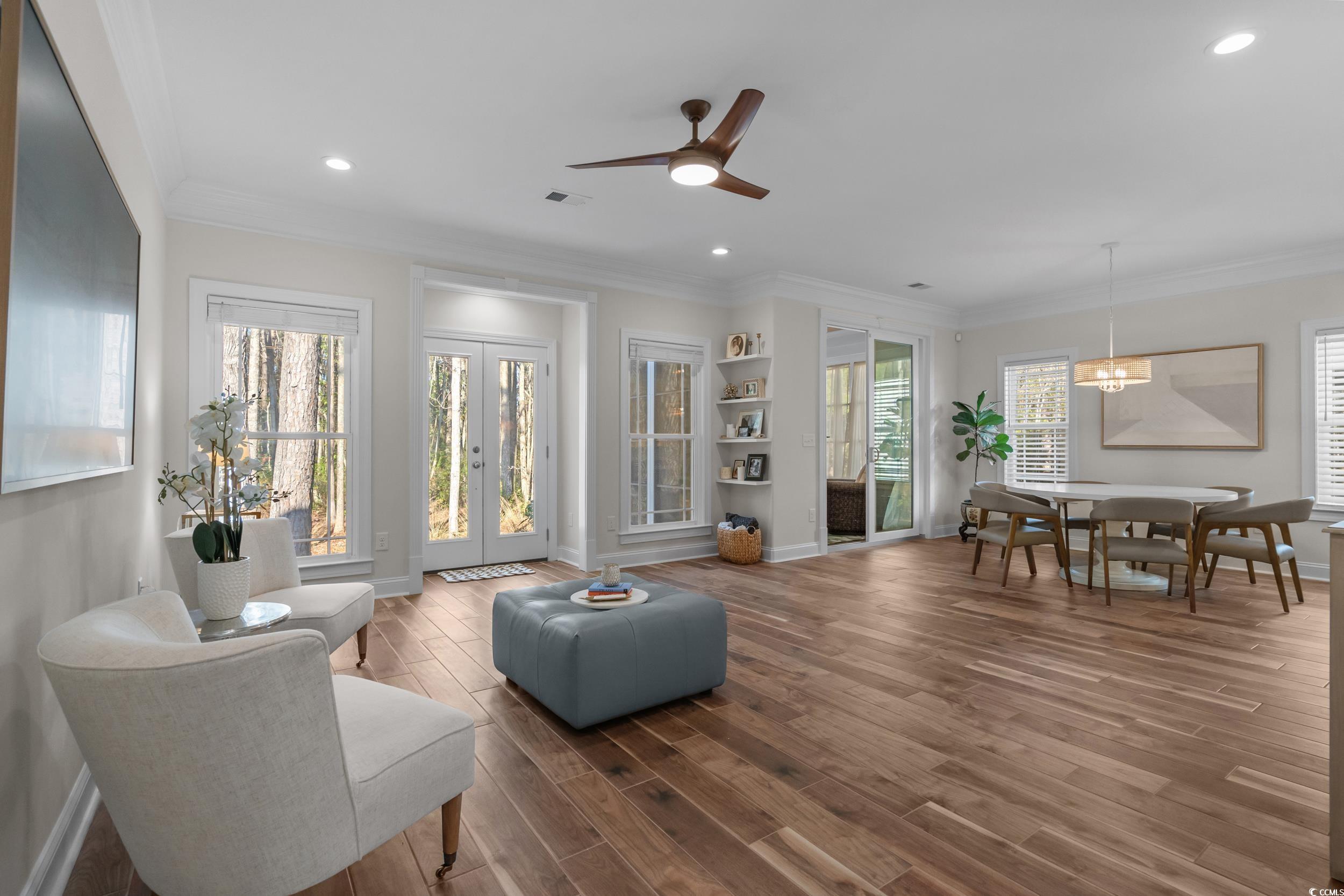 3021 Moss Bridge Lane Myrtle Beach, SC 29579 - Photo 10 of 40 Living area featuring french doors, crown molding, a ceiling fan, wood finished floors, and recessed lighting