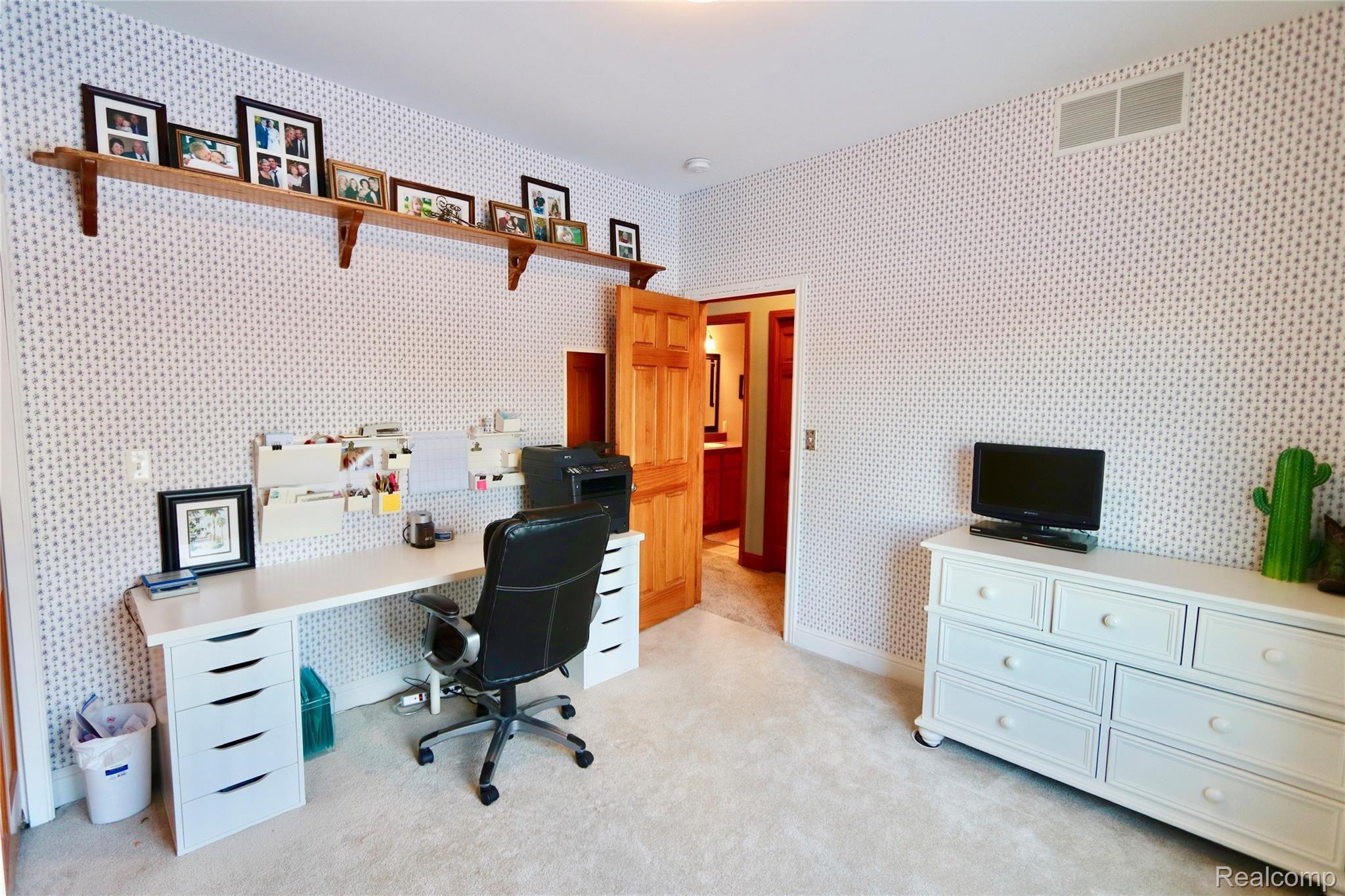 7751 Munsell Road Howell, MI 48843 - Photo 42 of 60 Large bedroom with built-in shelving.