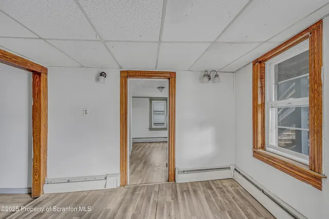 a kitchen with cabinets a refrigerator and a stove