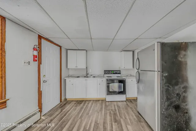 a view of room with window and hardwood floor