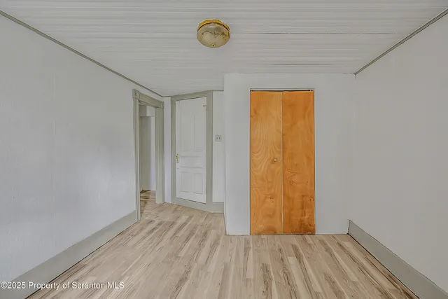 a bathroom with a toilet a sink and a mirror