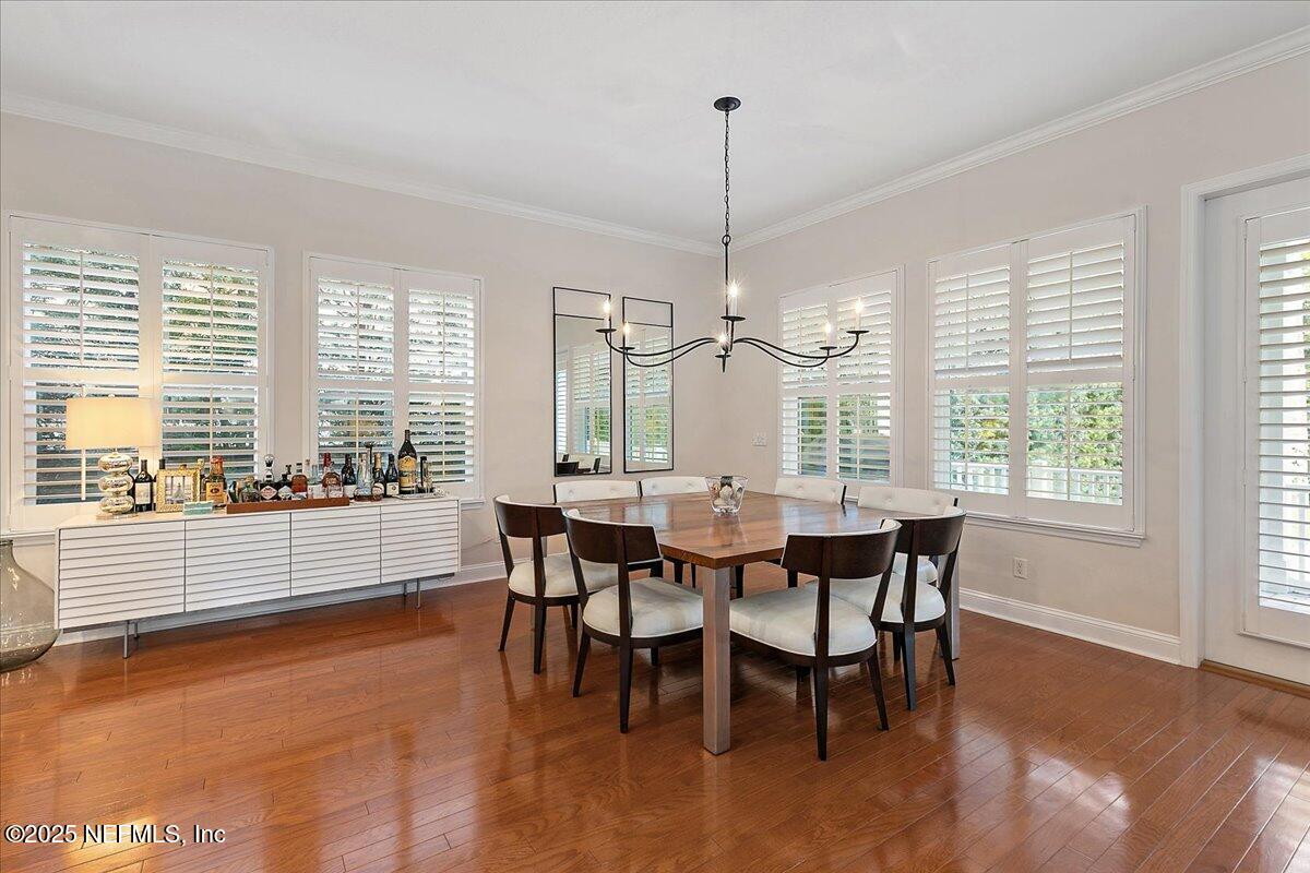 321 Fifth Street Atlantic Beach, FL 32233 - Photo 12 of 33 a view of a dining room with furniture window and wooden floor