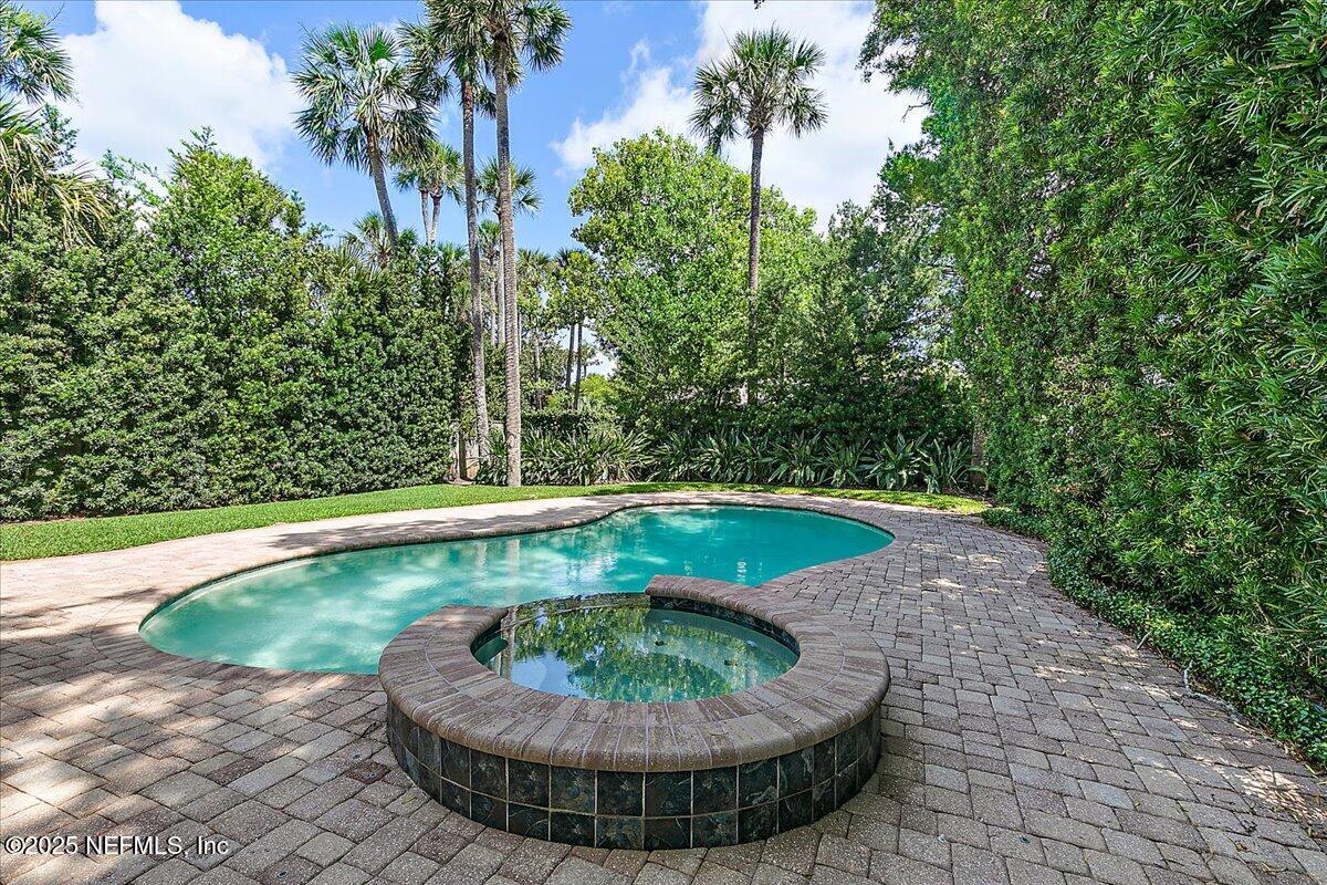 321 Fifth Street Atlantic Beach, FL 32233 - Photo 19 of 33 a view of a swimming pool with a yard