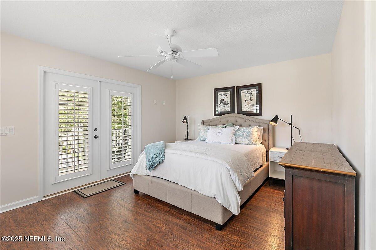321 Fifth Street Atlantic Beach, FL 32233 - Photo 24 of 33 a bedroom with a bed and a window