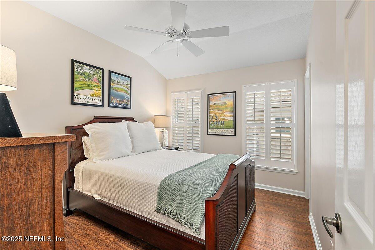 321 Fifth Street Atlantic Beach, FL 32233 - Photo 26 of 33 a bedroom with a bed and a table with closet