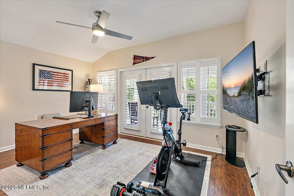 321 Fifth Street Atlantic Beach, FL 32233 - Photo 27 of 33 a view of a workspace with furniture and a flat screen tv