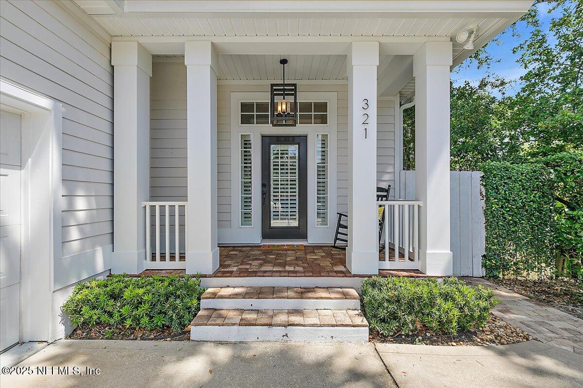 321 Fifth Street Atlantic Beach, FL 32233 - Photo 7 of 33 a front view of a house with a yard
