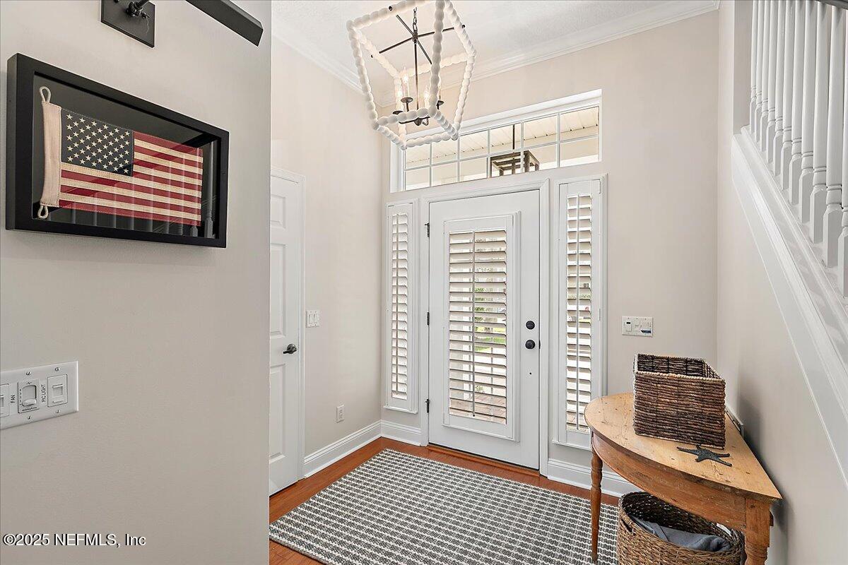 321 Fifth Street Atlantic Beach, FL 32233 - Photo 8 of 33 a view of a livingroom with wooden floor and windows