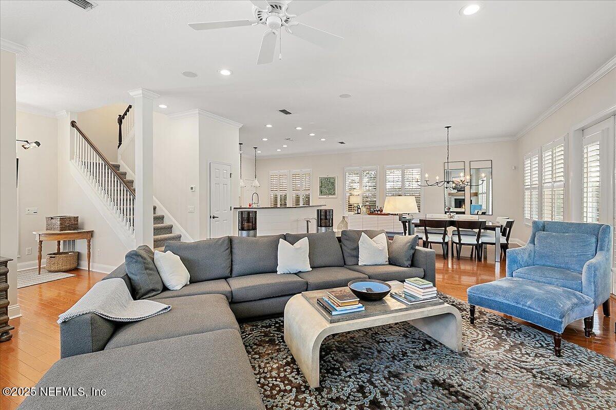 321 Fifth Street Atlantic Beach, FL 32233 - Photo 10 of 33 a living room with furniture kitchen view and a chandelier