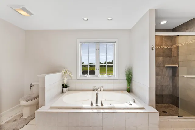 a bathroom with a bathtub and a sink