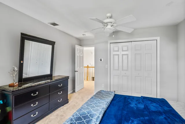 a view of a room with wooden floor and cabinet