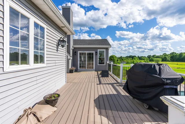 a view of roof deck with patio