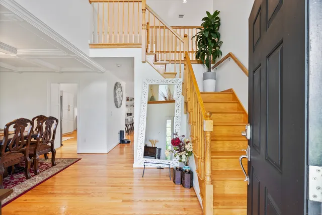 a view of living room filled with furniture and window