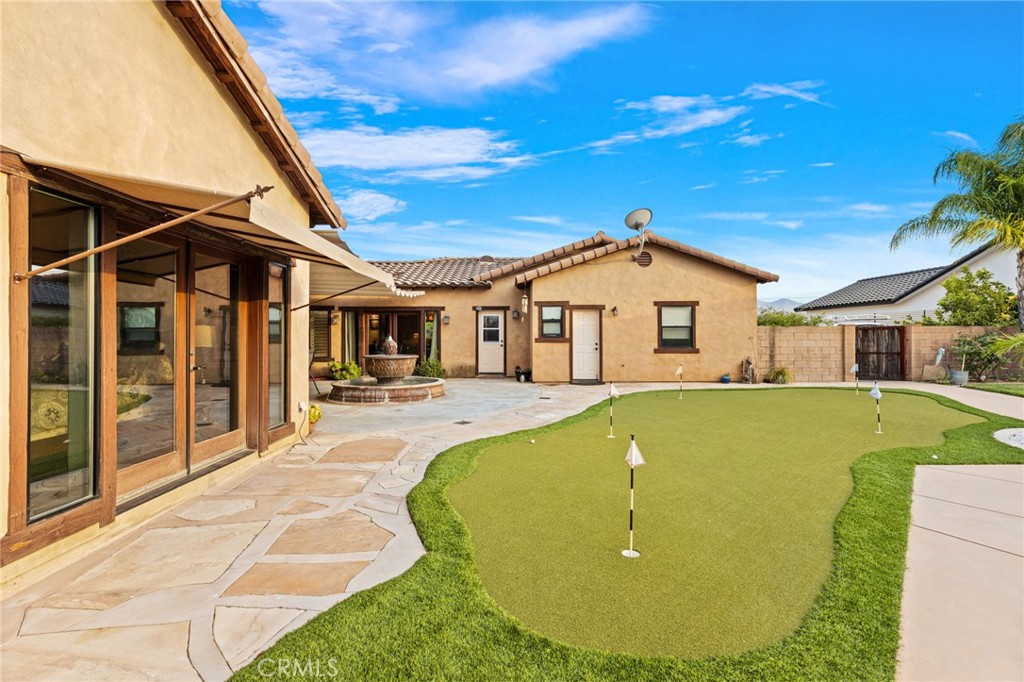 26487 Thacker Drive Hemet, CA 92544 - Photo 16 of 60 a front view of a house with swimming pool